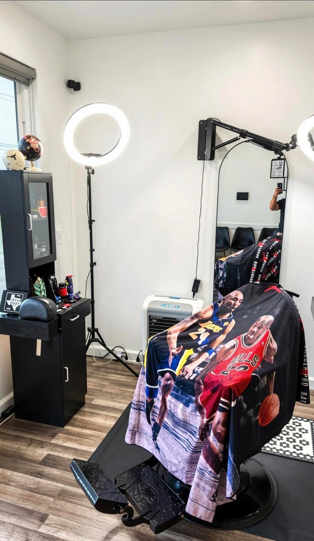 Premium barbershop studio with professional barber chair and ring lighting